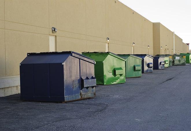 metal dump boxes positioned for construction cleanup in Fitchburg